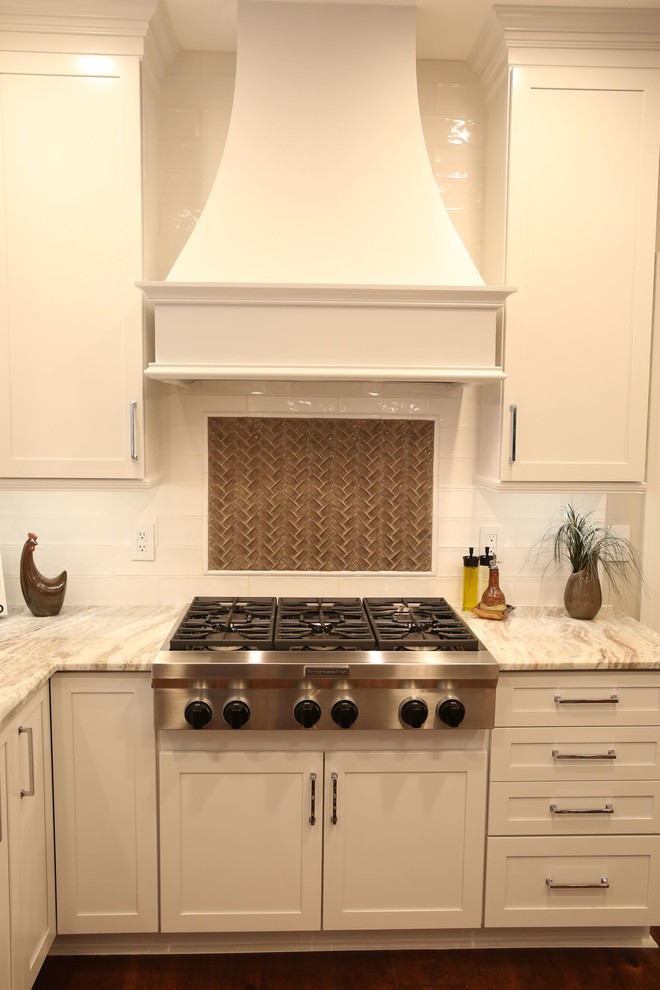 Gas Range with White Hood, White Shaker Cabinets, and Luxurious Marble Counterto - Traditional ...