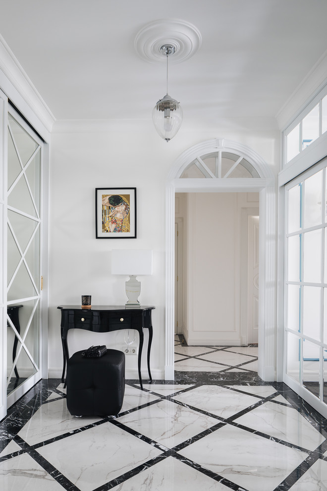 Design ideas for a traditional entryway in Saint Petersburg with white walls and multi-coloured floor.