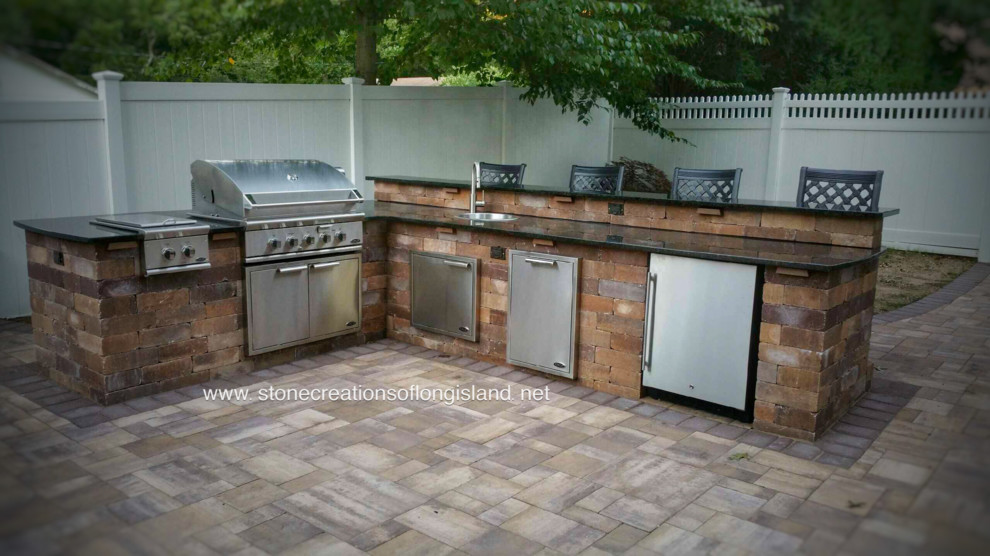 This is an example of a large contemporary patio in New York.
