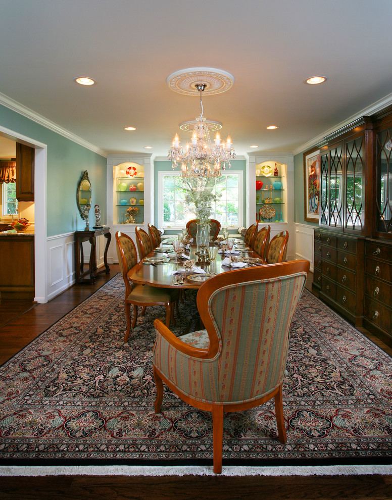 Inspiration for a traditional dining room in Detroit with blue walls and dark hardwood floors.