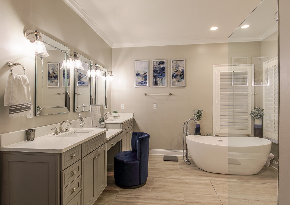 Photo of a large transitional master bathroom in Other with shaker cabinets, grey cabinets, a freestanding tub, a corner shower, grey walls, an undermount sink, beige floor, an open shower, white benchtops, a double vanity and a built-in vanity.