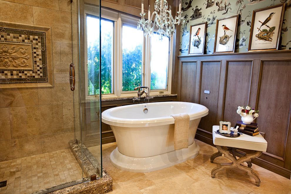 Design ideas for a mid-sized traditional master bathroom in St Louis with a freestanding tub, recessed-panel cabinets, medium wood cabinets, an open shower, beige tile, porcelain tile, multi-coloured walls, travertine floors, an undermount sink and a hinged shower door.
