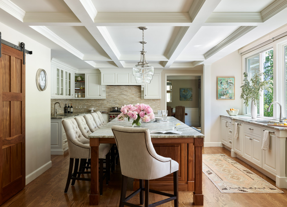 Large traditional galley eat-in kitchen in Boston with white cabinets, quartzite benchtops, medium hardwood floors, with island, brown floor, coffered and brown benchtop.