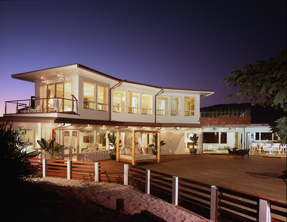 Inspiration for a mid-sized beach style two-storey exterior in Santa Barbara with a flat roof.