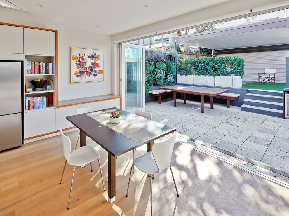 Inspiration for a contemporary backyard patio in Sydney with tile.