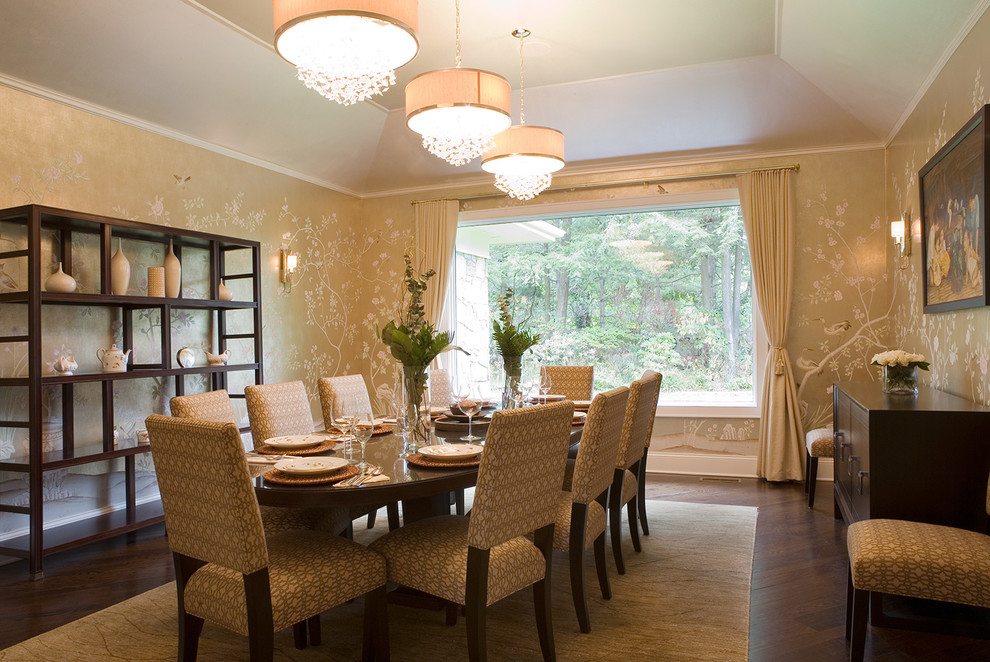 Photo of a large traditional separate dining room in New York with brown walls, dark hardwood floors, no fireplace and brown floor.