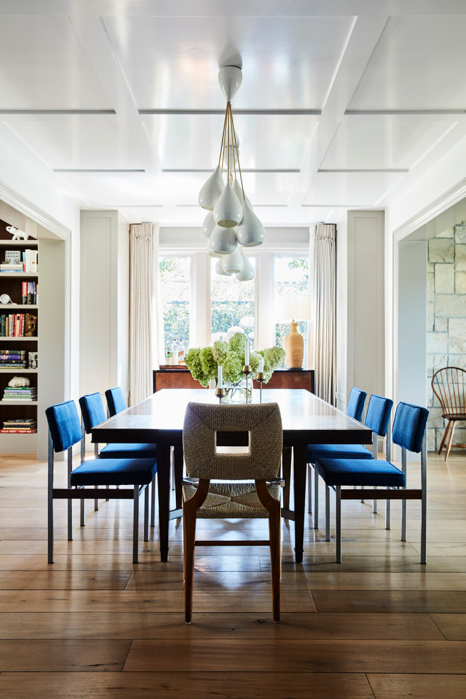 Large beach style dining room in Los Angeles with medium hardwood floors and coffered.