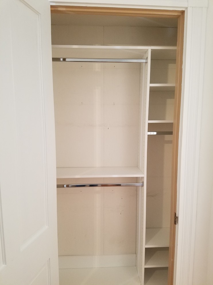 Inspiration for a small transitional gender-neutral carpeted and brown floor reach-in closet remodel in Louisville with open cabinets and white cabinets