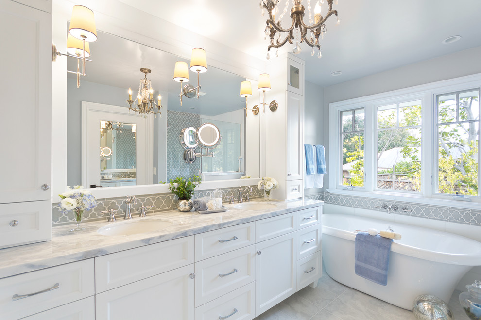 Design ideas for a traditional bathroom in San Francisco with an undermount sink, recessed-panel cabinets, white cabinets and a freestanding tub.
