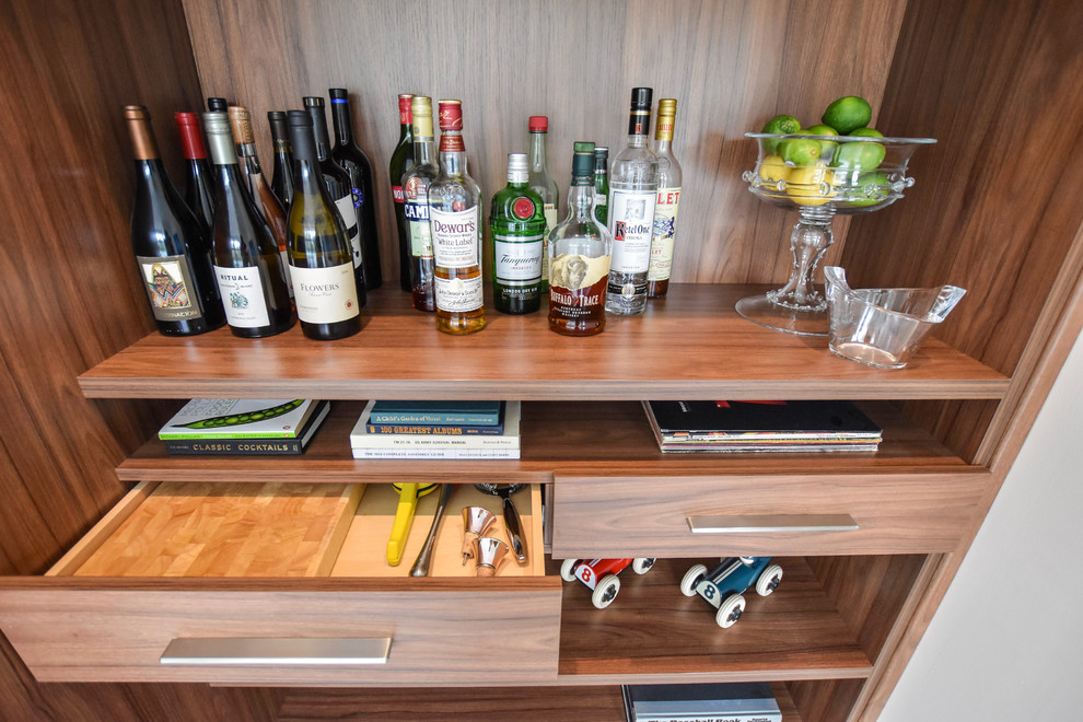 Inspiration for a small midcentury single-wall wet bar in Detroit with no sink, open cabinets, brown cabinets, wood benchtops, brown splashback and timber splashback.