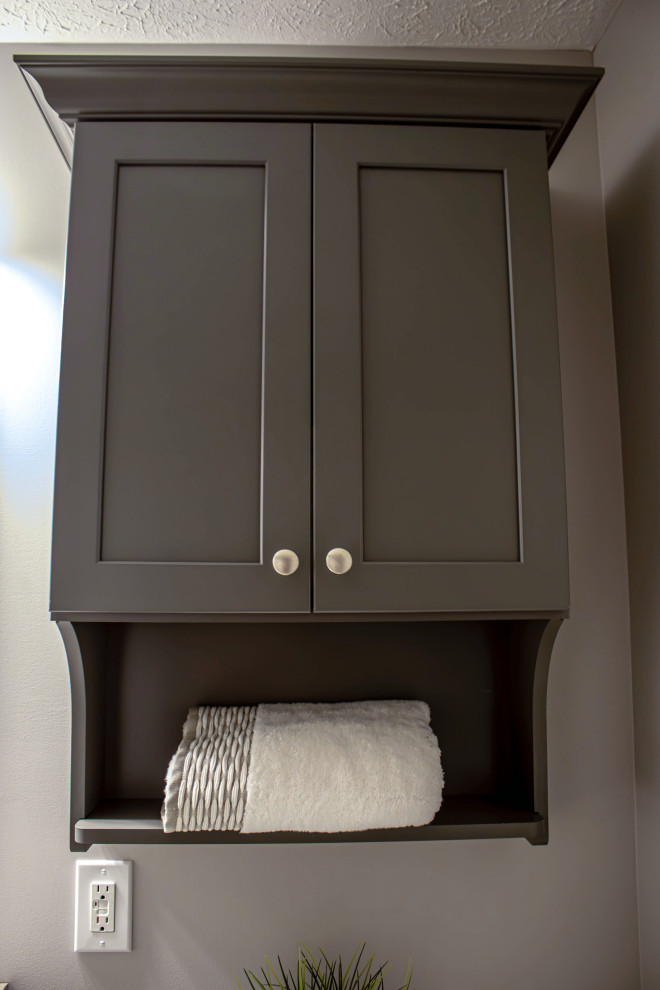 Small traditional cloakroom in Cleveland with flat-panel cabinets, grey cabinets, a two-piece toilet, grey walls, wood-effect flooring, a built-in sink, laminate worktops, beige floors, beige worktops and a built in vanity unit.
