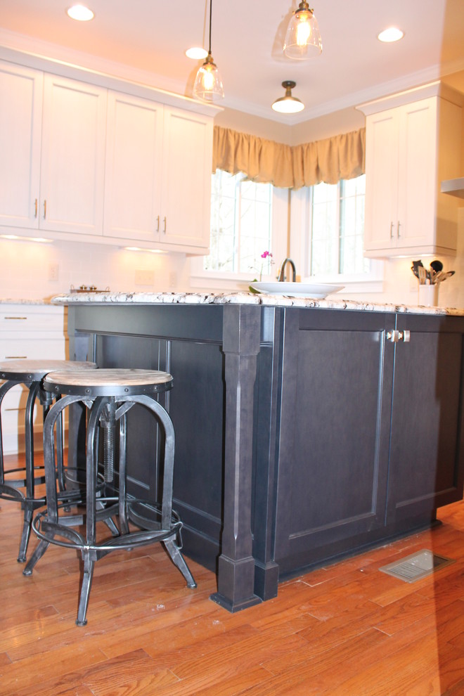 This is an example of a transitional kitchen in Raleigh.
