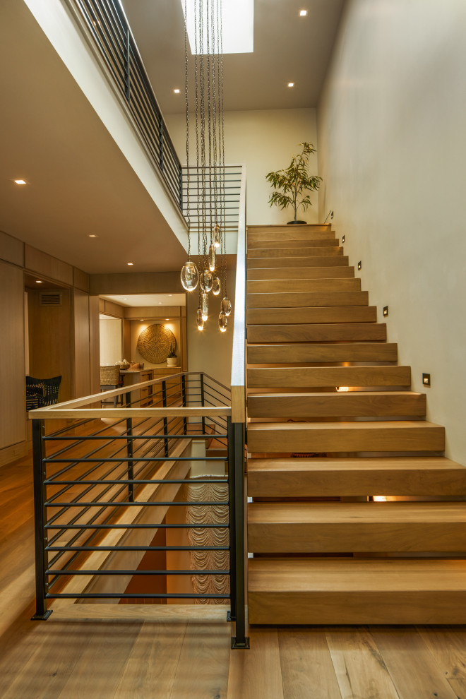 Staircase - modern wooden floating open and metal railing staircase idea in Denver