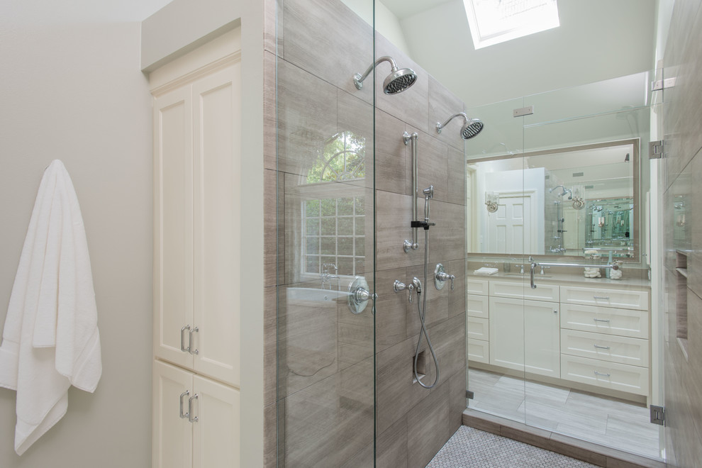 Inspiration for a large transitional master bathroom in Dallas with shaker cabinets, white cabinets, engineered quartz benchtops, a freestanding tub, an open shower, a one-piece toilet, beige tile, stone tile, green walls, travertine floors and an undermount sink.