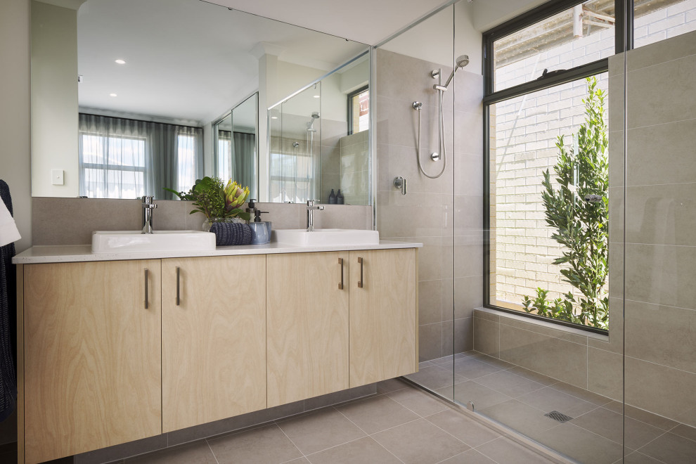 Design ideas for a contemporary bathroom in Perth with flat-panel cabinets, light wood cabinets, an alcove shower, gray tile, a vessel sink, grey floor, white benchtops, a double vanity and a built-in vanity.