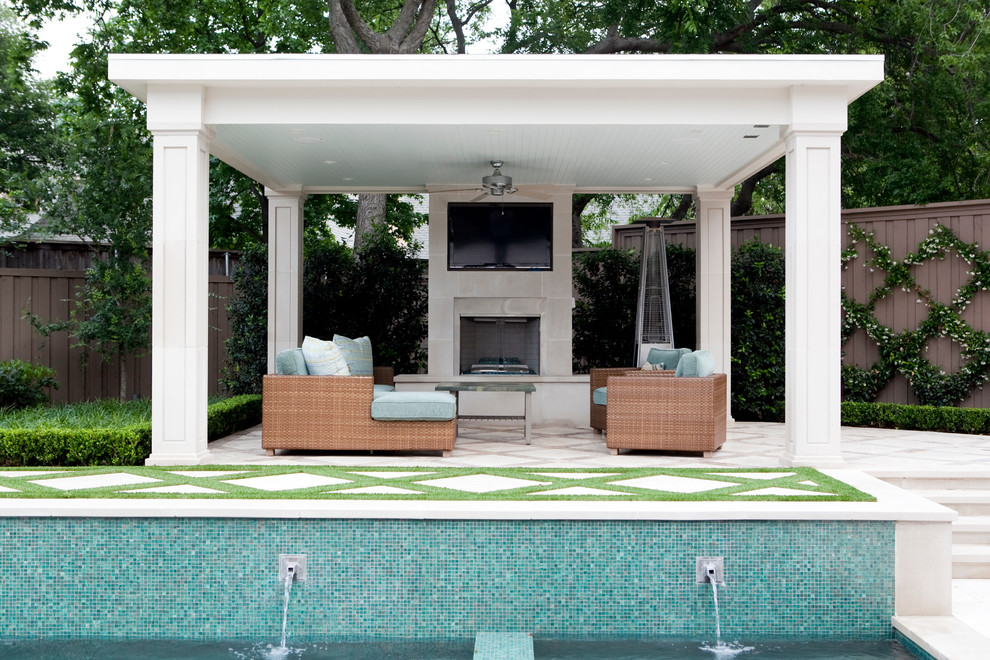 Inspiration for a mid-sized transitional backyard patio in Dallas with natural stone pavers and a gazebo/cabana.
