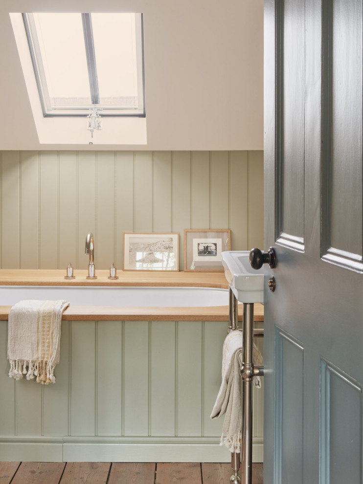 Medium sized traditional family bathroom in London with flat-panel cabinets, a built-in bath, a corner shower, a wall mounted toilet, multi-coloured walls, medium hardwood flooring, a pedestal sink, a sliding door, a wall niche, a single sink, a freestanding vanity unit and tongue and groove walls.