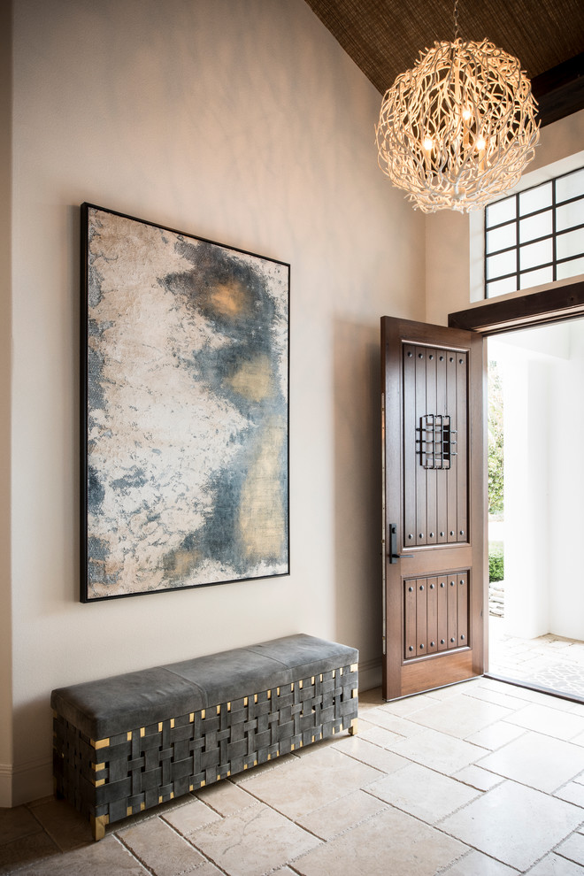 This is an example of a mid-sized contemporary foyer in Orlando with white walls, travertine floors, a single front door and a dark wood front door.