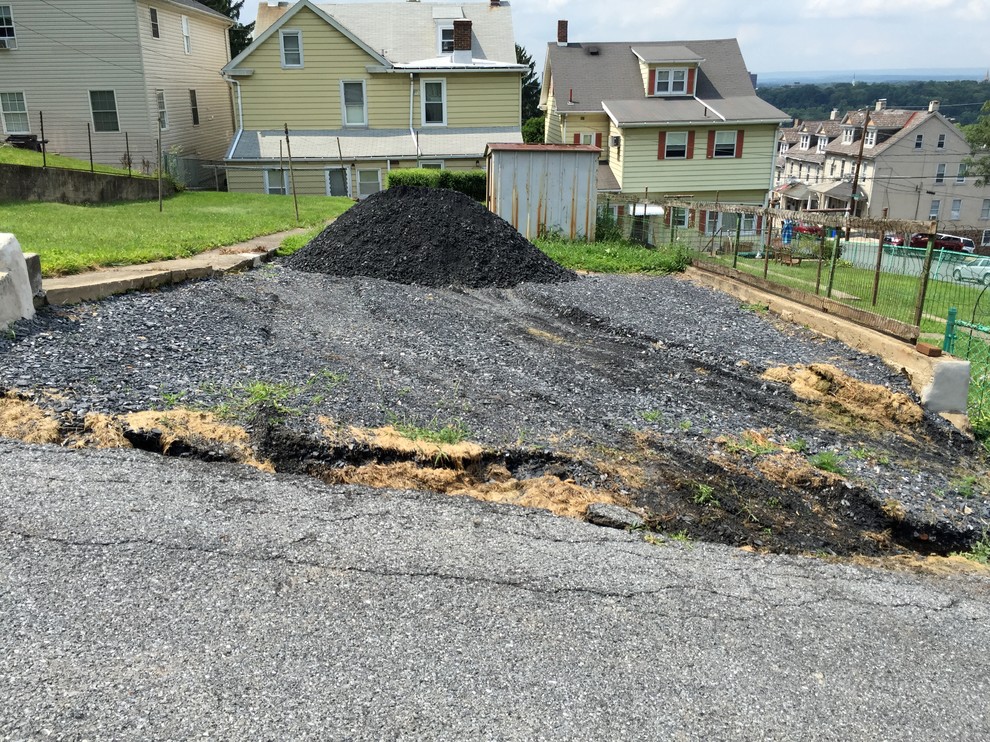 Failing Wall / Asphalt Parking Area