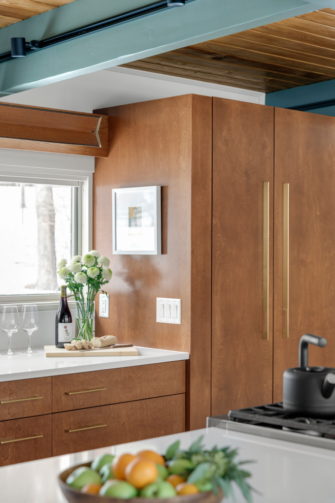 Mid-sized midcentury eat-in kitchen in Minneapolis with an undermount sink, flat-panel cabinets, brown cabinets, quartz benchtops, white splashback, engineered quartz splashback, panelled appliances, terrazzo floors, with island, white floor, white benchtop and exposed beam.