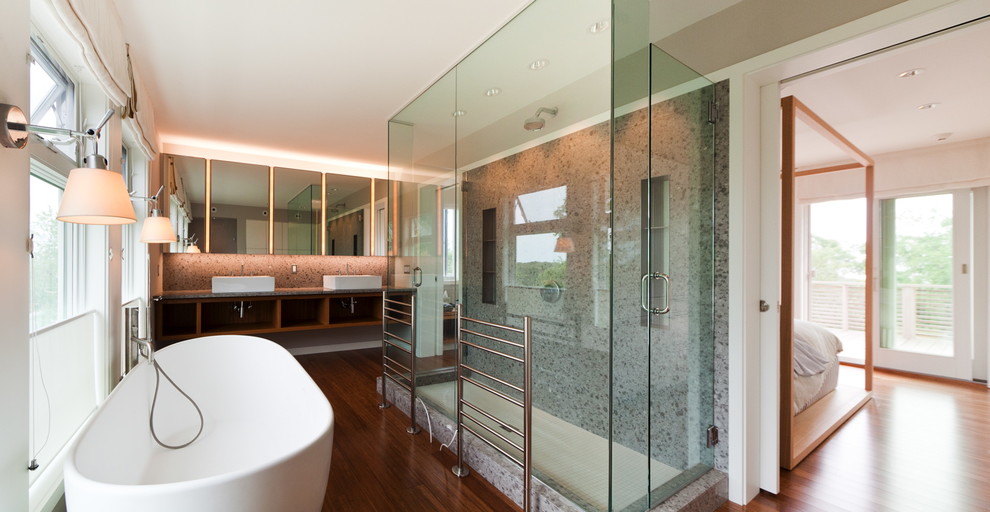 This is an example of a large contemporary master bathroom in New York with open cabinets, medium wood cabinets, a freestanding tub, an open shower, yellow tile, white walls, bamboo floors, a vessel sink and engineered quartz benchtops.
