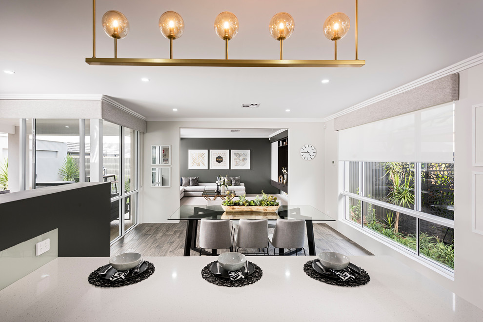 Design ideas for a large modern galley open plan kitchen in Perth with a double-bowl sink, flat-panel cabinets, dark wood cabinets, quartz benchtops, glass sheet splashback, stainless steel appliances, porcelain floors and with island.
