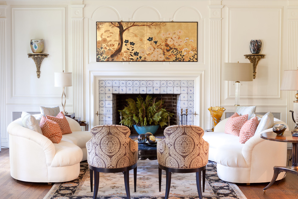 Inspiration for a traditional living room in St Louis with white walls, dark hardwood floors, a standard fireplace and a tile fireplace surround.