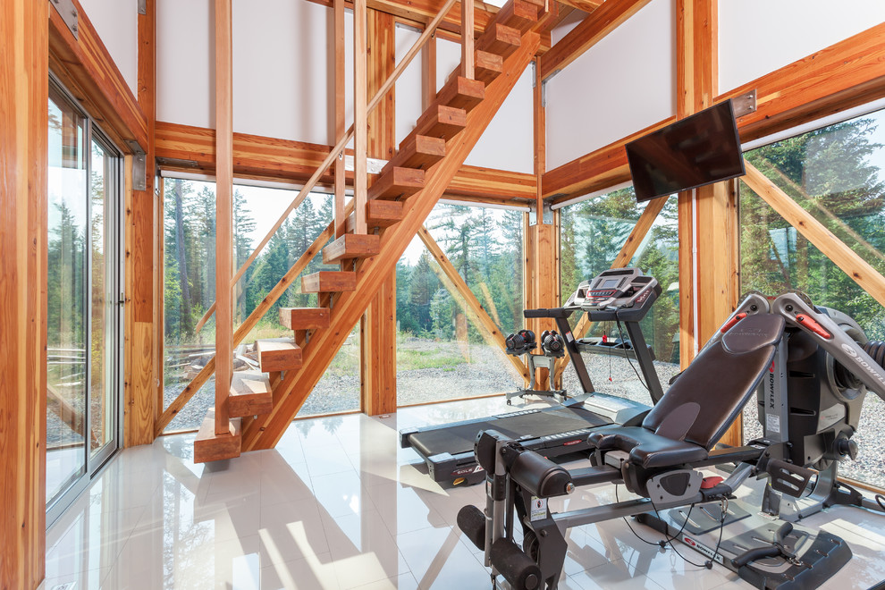 Photo of a contemporary multi-use home gym in Other with white walls and white floors.