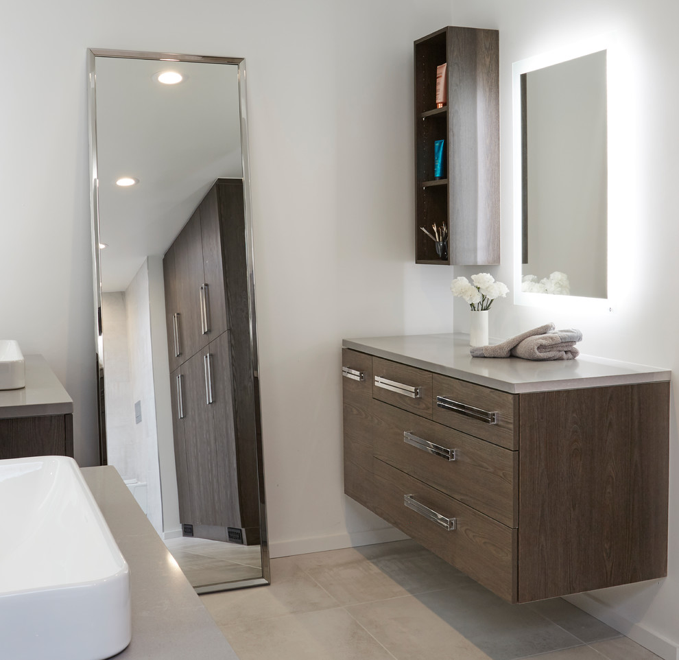 Design ideas for an expansive contemporary master wet room bathroom in Chicago with flat-panel cabinets, dark wood cabinets, a wall-mount toilet, gray tile, porcelain tile, grey walls, porcelain floors, a vessel sink, engineered quartz benchtops, grey floor and an open shower.