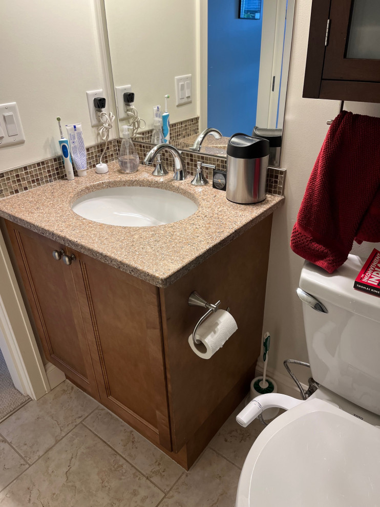Bathroom vanity with sinks, white cabinets, and mirrors