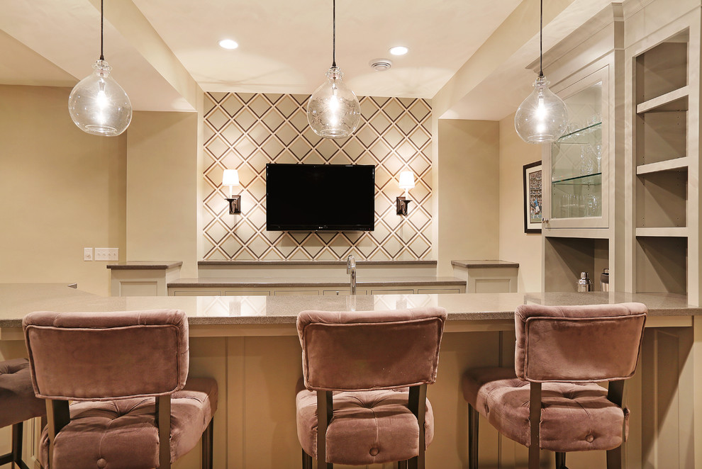 Transitional galley seated home bar in Minneapolis with beige cabinets and beige splashback.