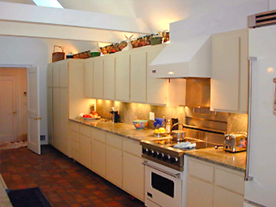 Mid-sized transitional single-wall ceramic tile enclosed kitchen photo in Boston with a drop-in sink, white cabinets, granite countertops and stainless steel appliances