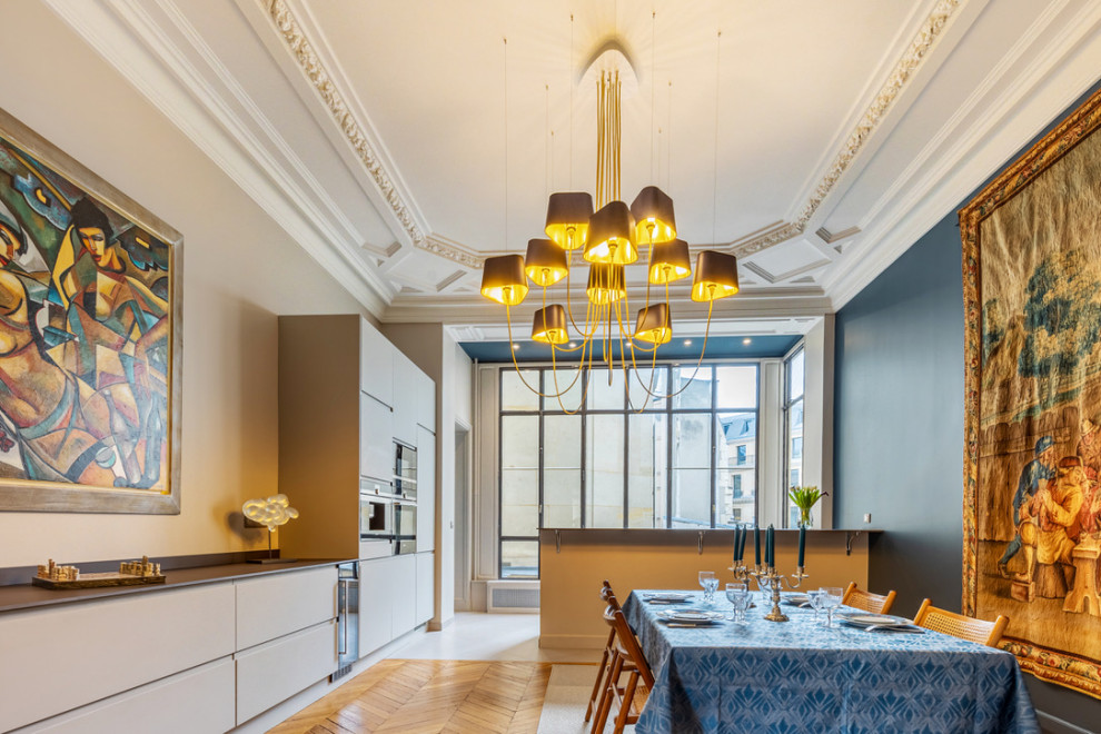 Design ideas for a large traditional open plan dining in Paris with beige walls and coffered.