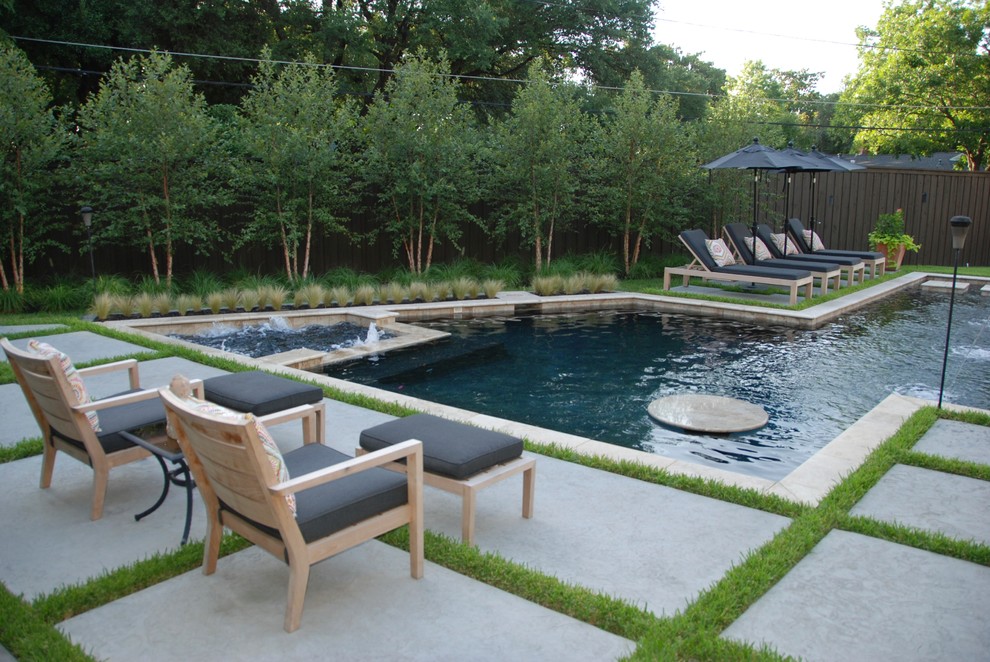 Contemporary backyard rectangular natural pool in Dallas with a hot tub and concrete slab.