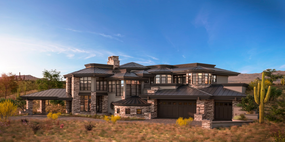 Expansive modern two-storey grey house exterior in Phoenix with stone veneer, a hip roof and a metal roof.