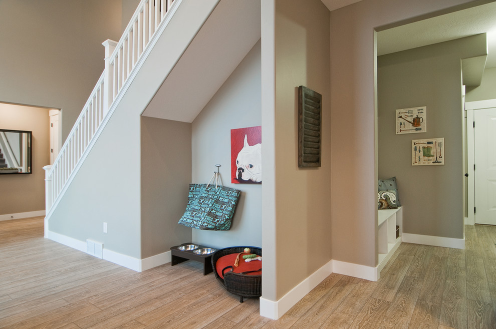 Inspiration for a contemporary foyer in Salt Lake City with grey walls, light hardwood floors and a white front door.