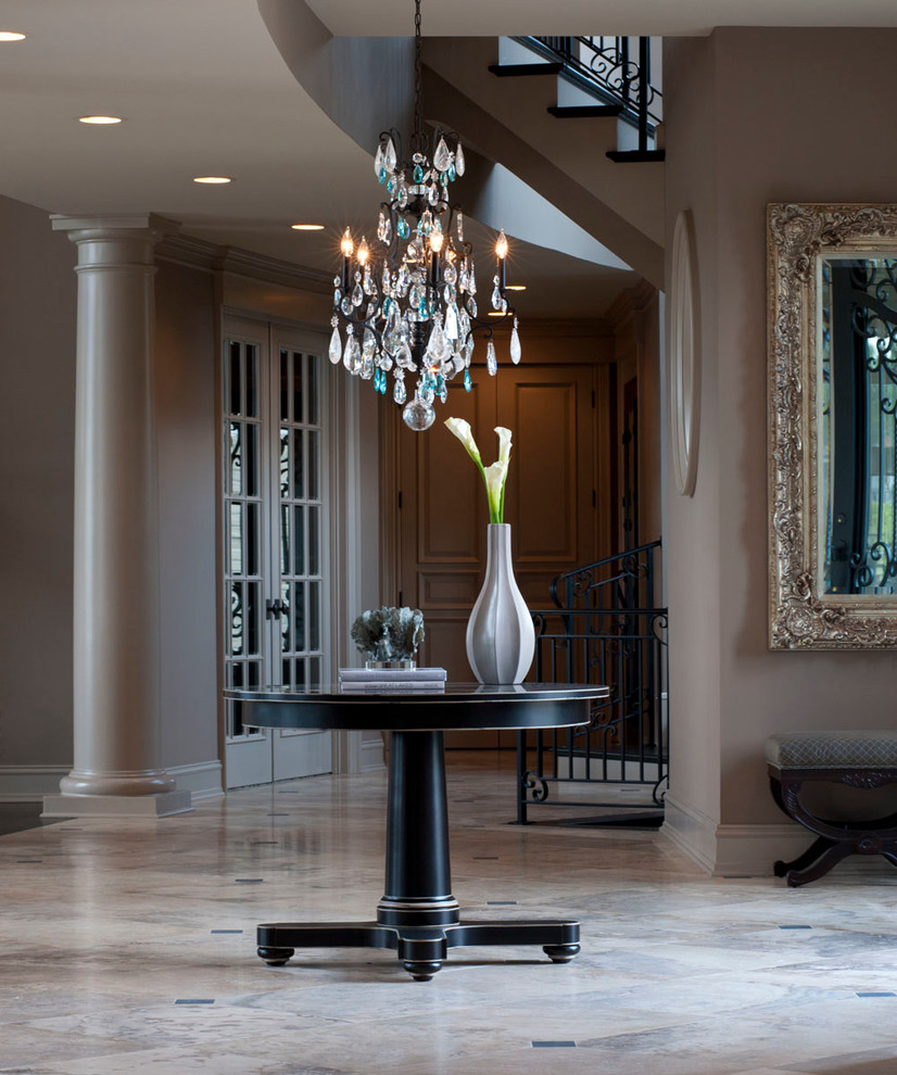 Expansive transitional foyer in Detroit with beige walls, travertine floors, a double front door and a gray front door.