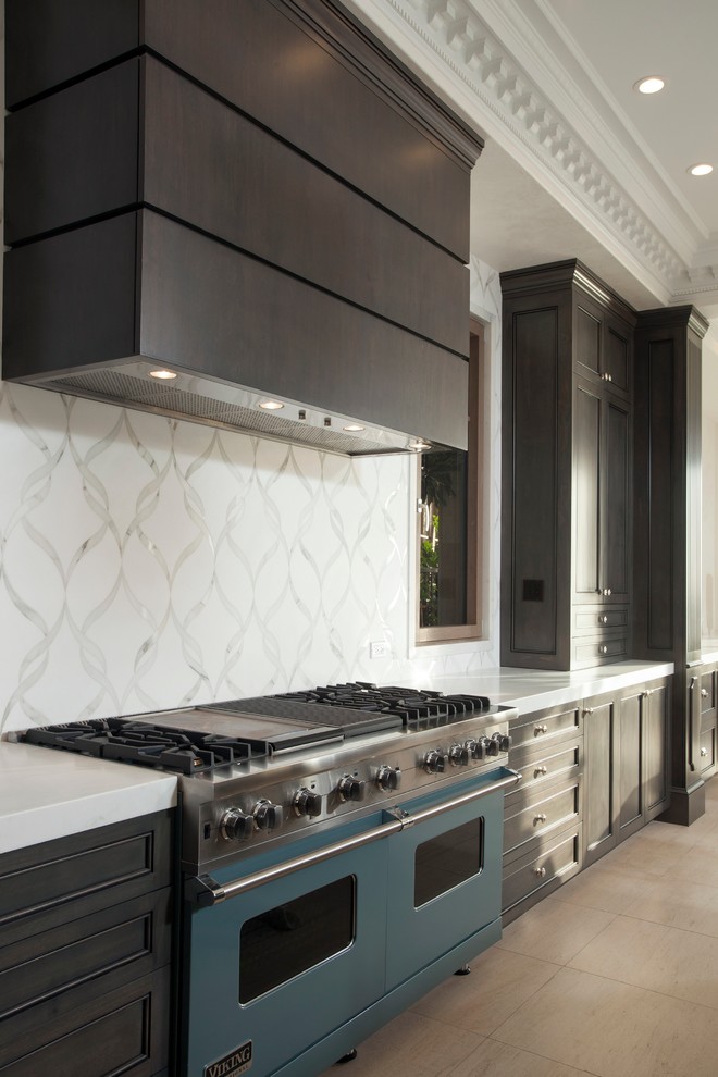 Open concept kitchen - large transitional l-shaped open concept kitchen idea in Orange County with recessed-panel cabinets, dark wood cabinets, marble countertops, white backsplash, colored appliances and an island