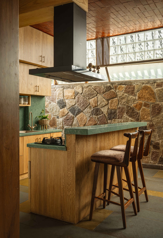 This is an example of a tropical kitchen in Bengaluru.