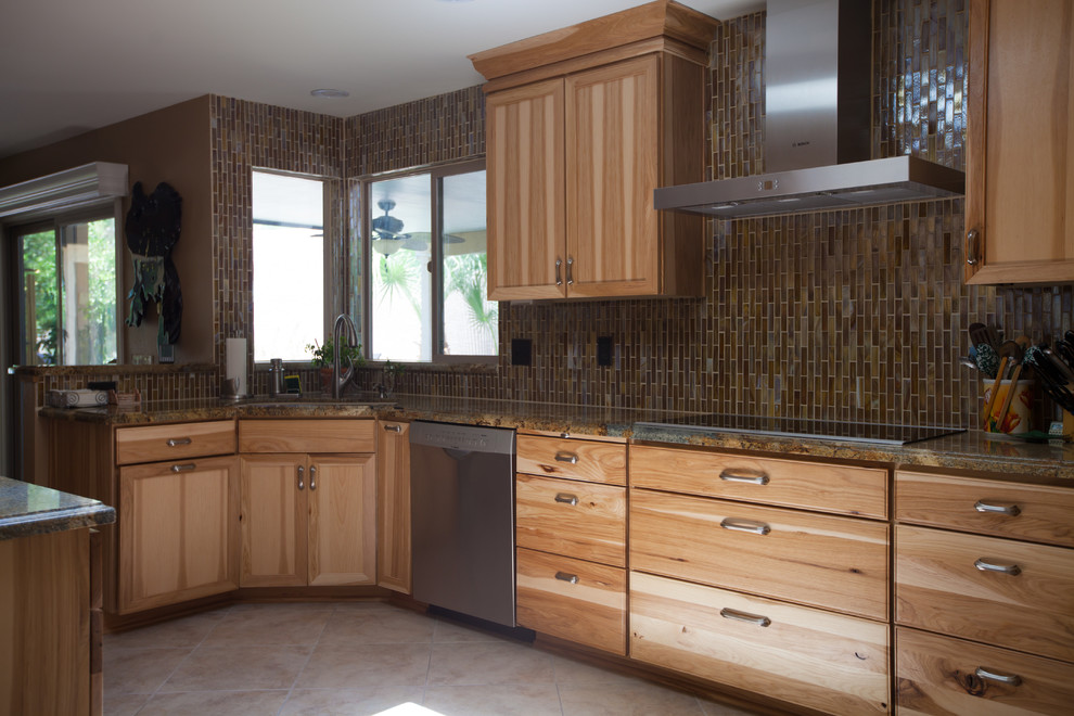 Inspiration for a large transitional galley ceramic tile enclosed kitchen remodel in Phoenix with an undermount sink, recessed-panel cabinets, light wood cabinets, granite countertops, brown backsplash, glass tile backsplash and stainless steel appliances