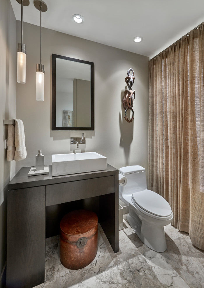 Inspiration for a mid-sized contemporary bathroom in Chicago with furniture-like cabinets, dark wood cabinets, an alcove tub, a one-piece toilet, travertine floors, a vessel sink, wood benchtops, a shower curtain, brown benchtops, a single vanity, a freestanding vanity, beige walls and beige floor.
