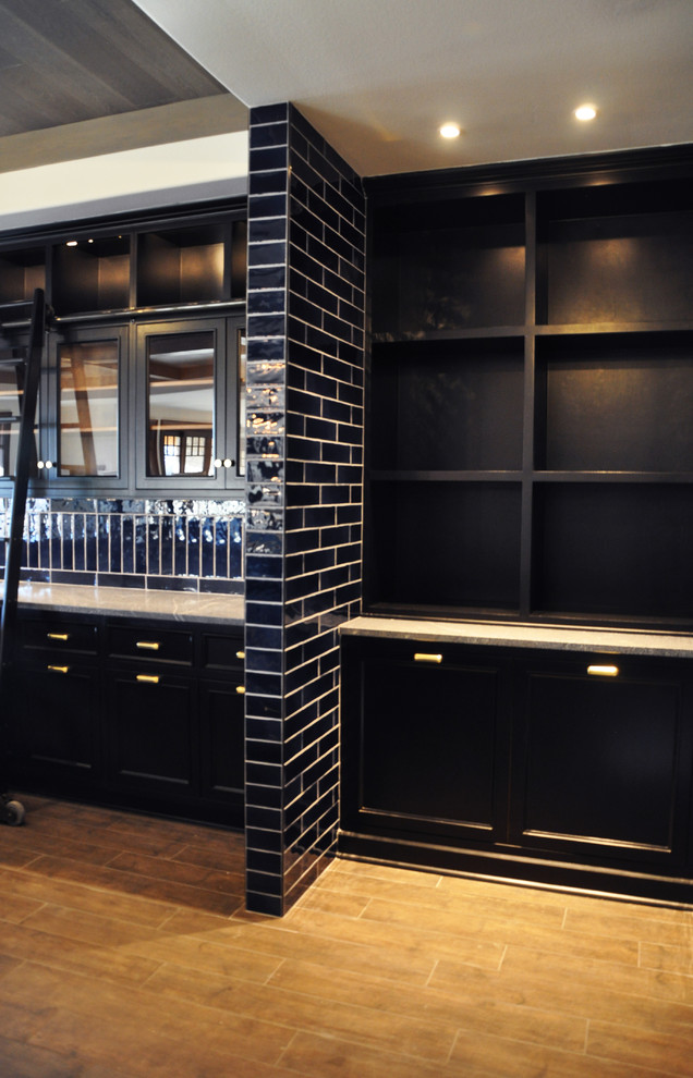 Home design - large transitional l-shaped brown floor home design idea in Milwaukee with glass-front cabinets, dark wood cabinets, blue backsplash and ceramic backsplash