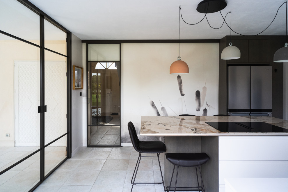 Inspiration for a mid-sized contemporary l-shaped separate kitchen in Angers with an integrated sink, beaded inset cabinets, beige cabinets, quartz benchtops, beige splashback, engineered quartz splashback, black appliances, ceramic floors, with island, beige floor, multi-coloured benchtop and wallpaper.