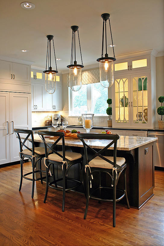 Kitchen - large transitional medium tone wood floor kitchen idea in Houston with an undermount sink, recessed-panel cabinets and an island