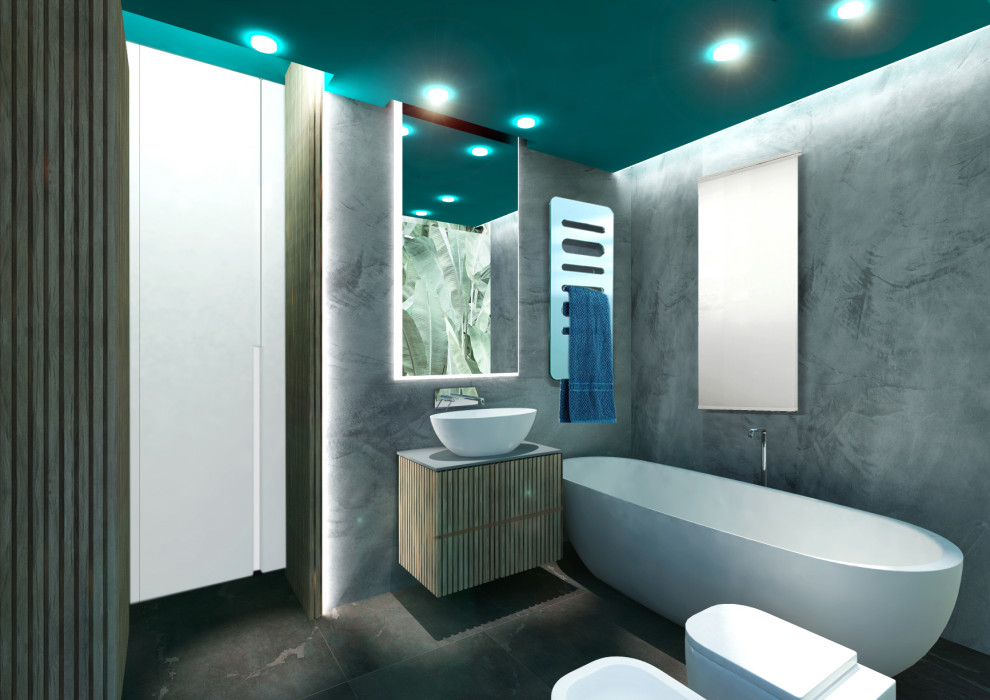 Small tropical master bathroom in Other with light wood cabinets, a freestanding tub, a wall-mount toilet, green walls, porcelain floors, a vessel sink, glass benchtops, grey floor, grey benchtops, a niche, a single vanity, a floating vanity, recessed and wallpaper.