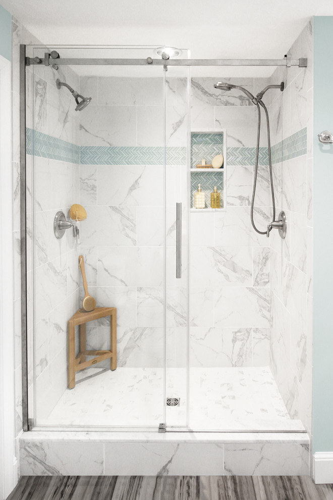 Mid-sized transitional master bathroom in Boston with shaker cabinets, distressed cabinets, an alcove shower, a two-piece toilet, white tile, ceramic tile, blue walls, ceramic floors, an undermount sink, engineered quartz benchtops, grey floor, a sliding shower screen and white benchtops.