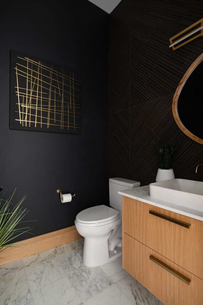 Inspiration for a small modern cloakroom in Salt Lake City with flat-panel cabinets, brown cabinets, a two-piece toilet, black tiles, porcelain tiles, black walls, marble flooring, a vessel sink, marble worktops, multi-coloured floors, white worktops and a floating vanity unit.