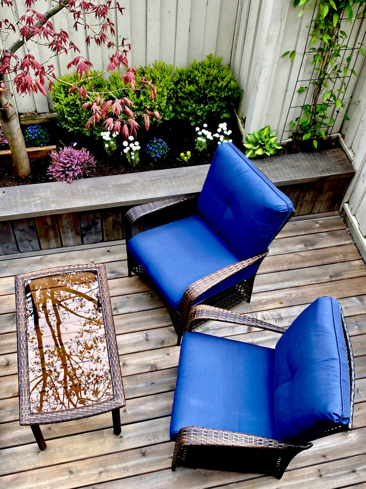 This is an example of a small rustic back ground level terrace in Vancouver with no cover.