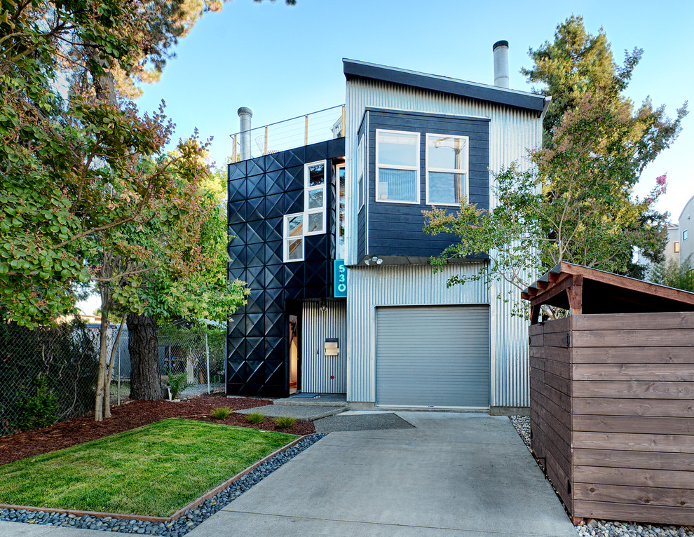 Inspiration for an industrial two-storey exterior in San Francisco with metal siding and a shed roof.