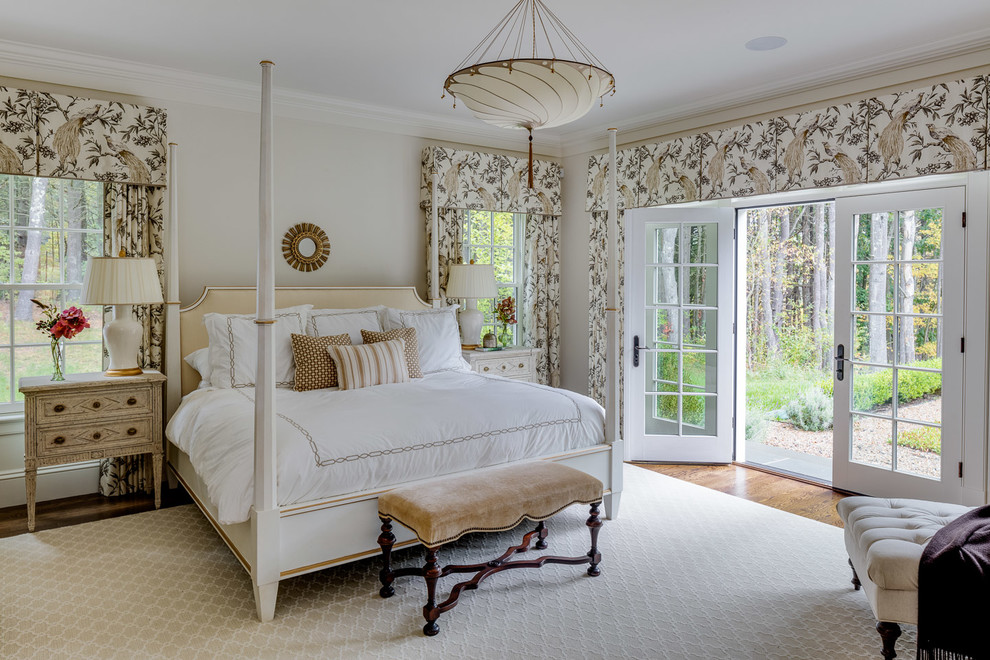 Design ideas for a mid-sized country master bedroom in Boston with no fireplace, grey walls and light hardwood floors.